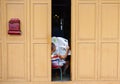 A man reading news at the house in George Town, Penang, Malaysia