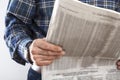 Man reading newspaper close up view Royalty Free Stock Photo