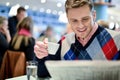 Man reading newspaper at outdoor cafe Royalty Free Stock Photo