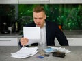 Man reading notice regarding late payments