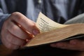 Man reading old holy Bible, closeup view Royalty Free Stock Photo