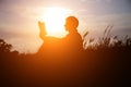 Man reading in the park against sunset Royalty Free Stock Photo