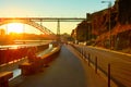 Man reading sunset embankment Portugal