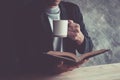 Man readingcoffee shop on a quiet