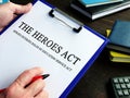 Man reads HEROES Act or Health and Economic Recovery Omnibus Emergency Solutions Act