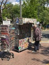 Man reads newspaper headlines