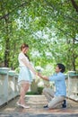 Man ready to give flowers to girlfriend