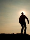 Man ready to jump. Adult crazy man is jumping on colorful sky background.Silhouette of man and beautiful sunset sky Royalty Free Stock Photo