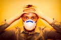 Man with real Coronavirus COVID-19 disease symptoms wears a protective mask Royalty Free Stock Photo