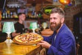 Man received delicious pizza. Enjoy your meal. Cheat meal concept. Hipster hungry eat italian pizza. Pizza favorite Royalty Free Stock Photo