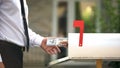 Man receiving dollars from mailbox, using transfer service, financial operations Royalty Free Stock Photo