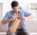 Man receiving empty parcel with stolen goods Royalty Free Stock Photo