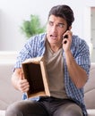 Man receiving empty parcel with stolen goods Royalty Free Stock Photo