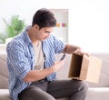 Man receiving empty parcel with stolen goods Royalty Free Stock Photo