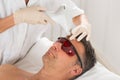 Man Receiving Laser Epilation Treatment