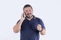 A man recognizes someone while on the phone talking. Isolated on a white backdrop. Communications concept Royalty Free Stock Photo