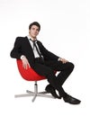 Man in red armchair Royalty Free Stock Photo