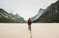Man with red backpack walking alone Royalty Free Stock Photo