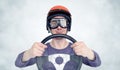 Man in red helmet and goggles with steering wheel. car driver concept Royalty Free Stock Photo