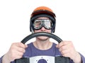 Man in red helmet and goggles with steering wheel, isolated on white background. car driver concept