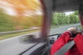 A man driving a car rushes along the highway. Royalty Free Stock Photo