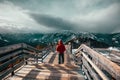 A man with a red jacket on Sulphur mountain at Banff, Canada