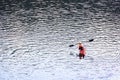BELIS-FANTANELE, ROMANIA, AUGUST 12, 2023: Red kayak on Belis-Fantanele dam lake, Ocidental Carpathians, Romania, Europe.