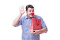 Man with a red nose funny holding a shopping bag gift present is Royalty Free Stock Photo