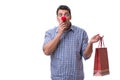 Man with a red nose funny holding a shopping bag gift present is Royalty Free Stock Photo