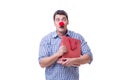 Man with a red nose funny holding a shopping bag gift present is