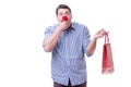 Man with a red nose funny holding a shopping bag gift present is Royalty Free Stock Photo