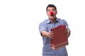 Man with a red nose funny holding a shopping bag gift present is