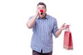 Man with a red nose funny holding a shopping bag gift present is Royalty Free Stock Photo