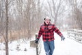 Man in plaid jacket having fun in the snow