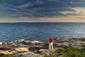 A man on the Rocky Coasting of Maine