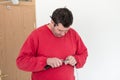 Man in red shirt stripping wire Royalty Free Stock Photo