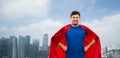 Man in red superhero cape over singapore city Royalty Free Stock Photo
