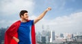 Man in red superhero cape over singapore city Royalty Free Stock Photo