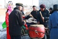 The man in red traditional coat Hit the drum