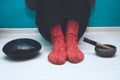 Man in a red woolen socks with a singing bowl and steel tongue drum