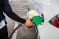 Man Refill and filling Oil Gas Fuel at station.Gas station - refueling. Royalty Free Stock Photo