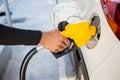 Man Refill and filling Oil Gas Fuel at station.Gas station - refueling. Royalty Free Stock Photo