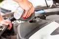 Man is refilling oil in his car Royalty Free Stock Photo