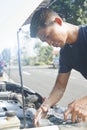 Man refilling wiper tank Royalty Free Stock Photo