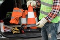 Man in a reflective vest and work gloves