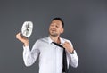 Man refreshing from heat in front of fan Royalty Free Stock Photo