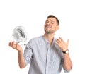 Man refreshing from heat in front of small fan Royalty Free Stock Photo
