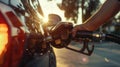 A man refuels a car at a gas station. AIG51A