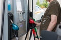 a man refuels a car at a gas station. Royalty Free Stock Photo
