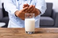 Man Refusing Glass Of Milk